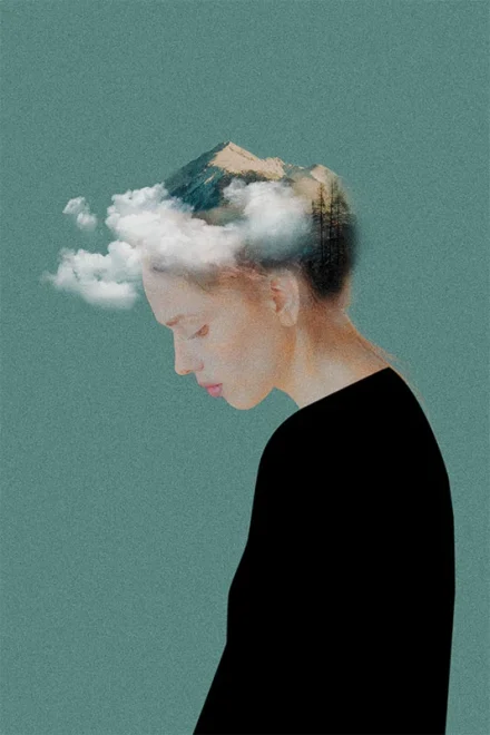 Photomontage of a woman with mountains and clouds on her head